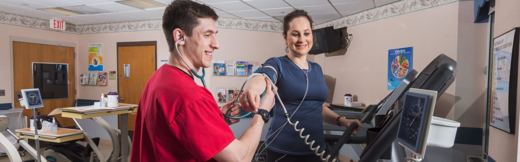 Exercise physiologist checking blood pressure