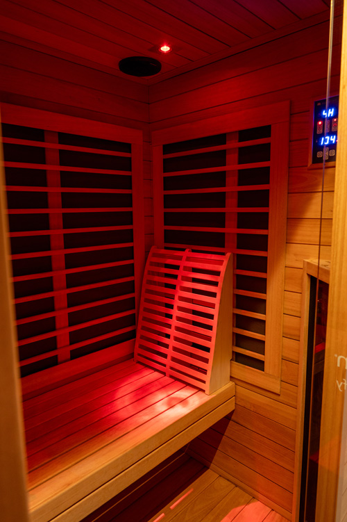 Infrared sauna cabin with red infrared heating panels at TriCryo in Erie, PA